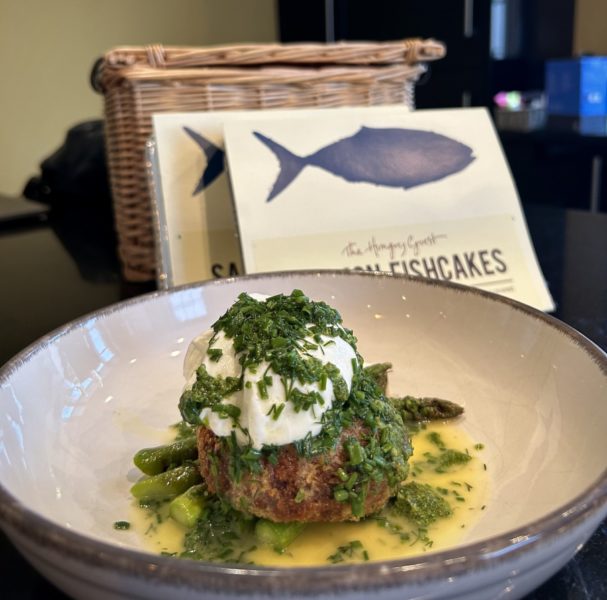 Plate of The Hungry Guest Salmon Fish Cake, poached egg, asparagus and lemon butter