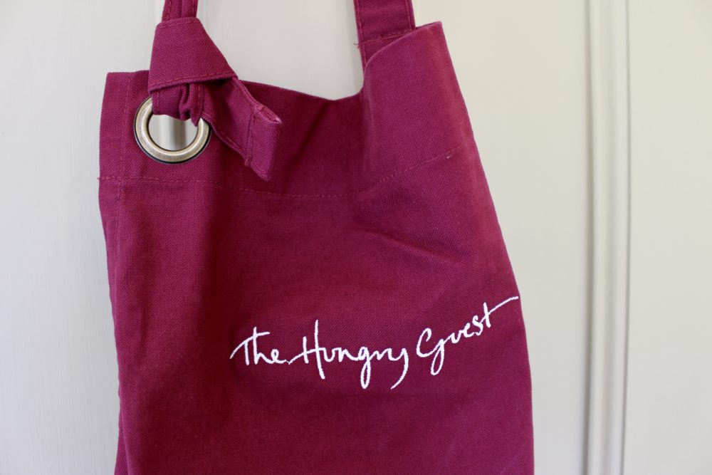 Image of the red Hungry Guest Apron